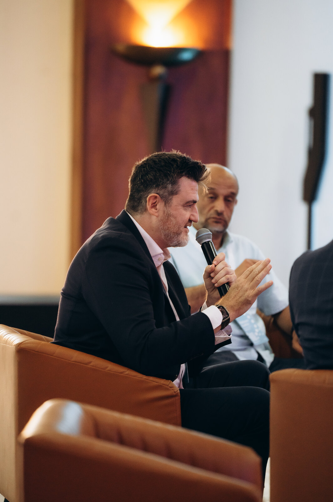 Tony Wood standing in conversation during a Morocco leadership programme.